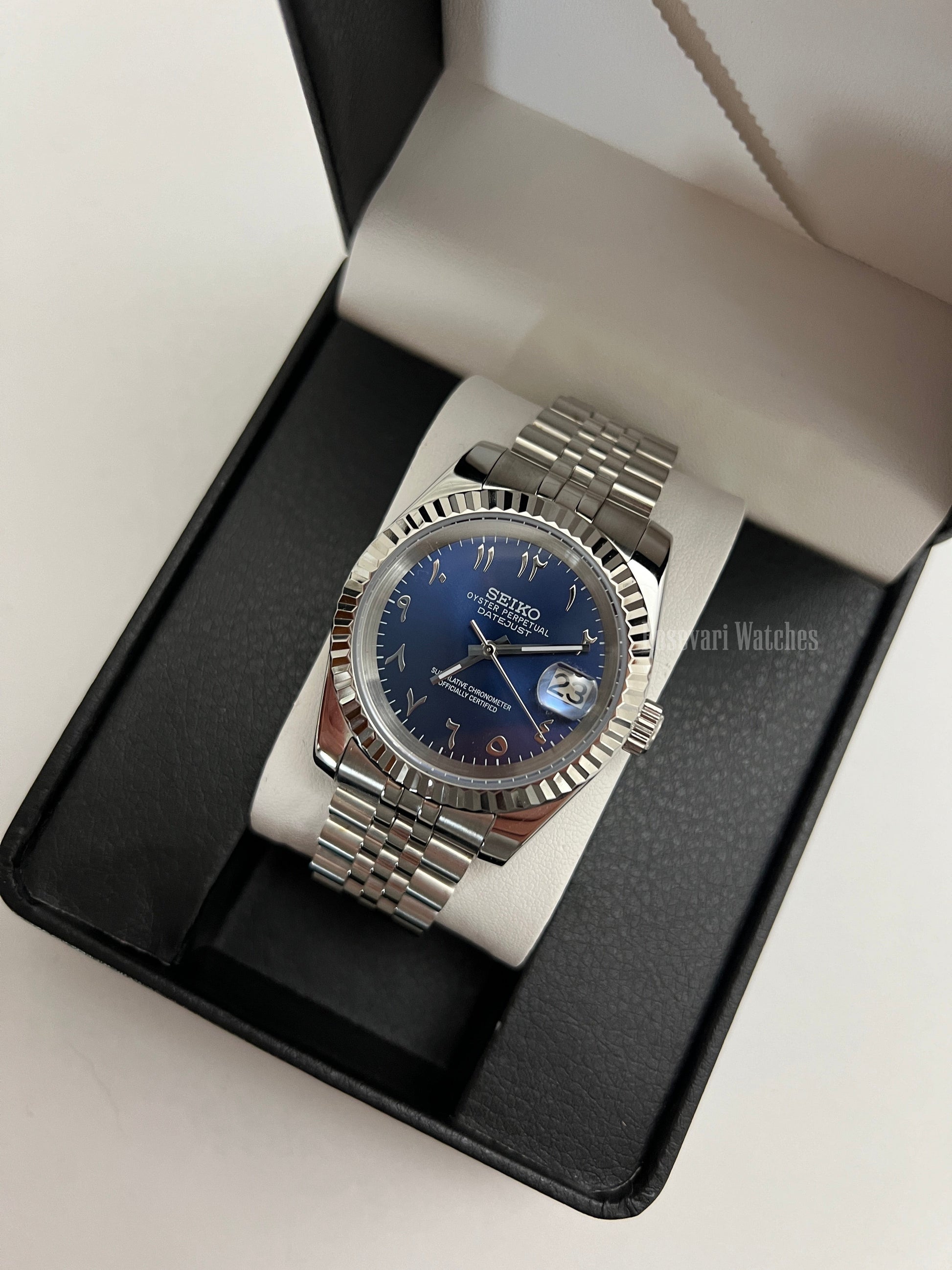 Datejust (Arabic Royal Blue) Seiko NH35 automatic mod watch. A blue dial watch with a silver fluted bezel and jubilee bracelet inside an open watch box.