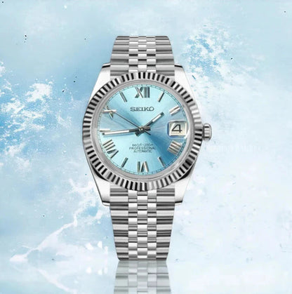 Datejust (Blue Roman) Seiko NH35 automatic mod watch. A full watch shot features a light blue dial with a silver fluted bezel and a silver metal jubilee bracelet.