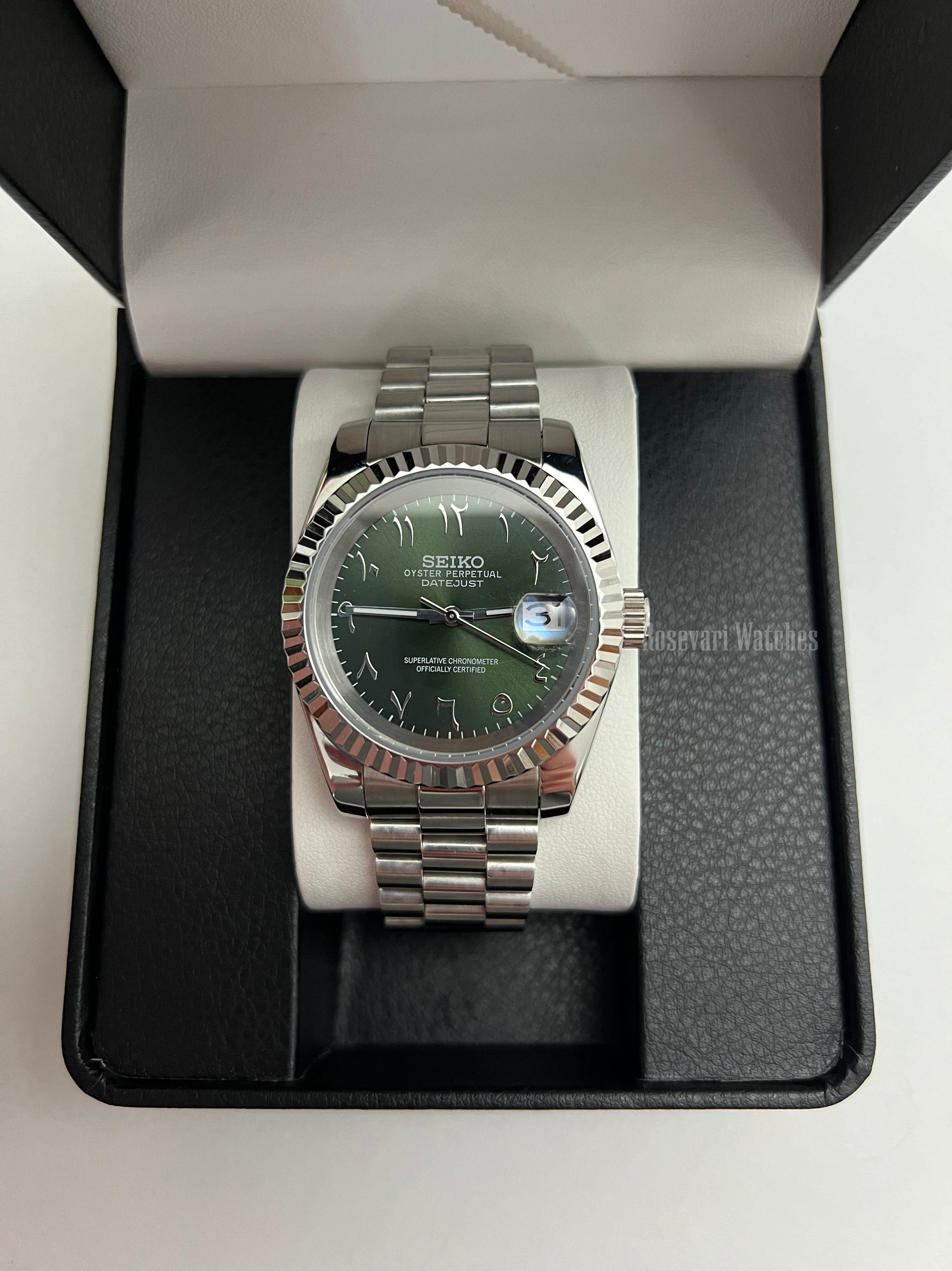 Datejust (Arabic Olive) Seiko NH35 automatic mod watch. A full watch with a green dial and silver fluted bezel on a silver jubilee bracelet inside a box.