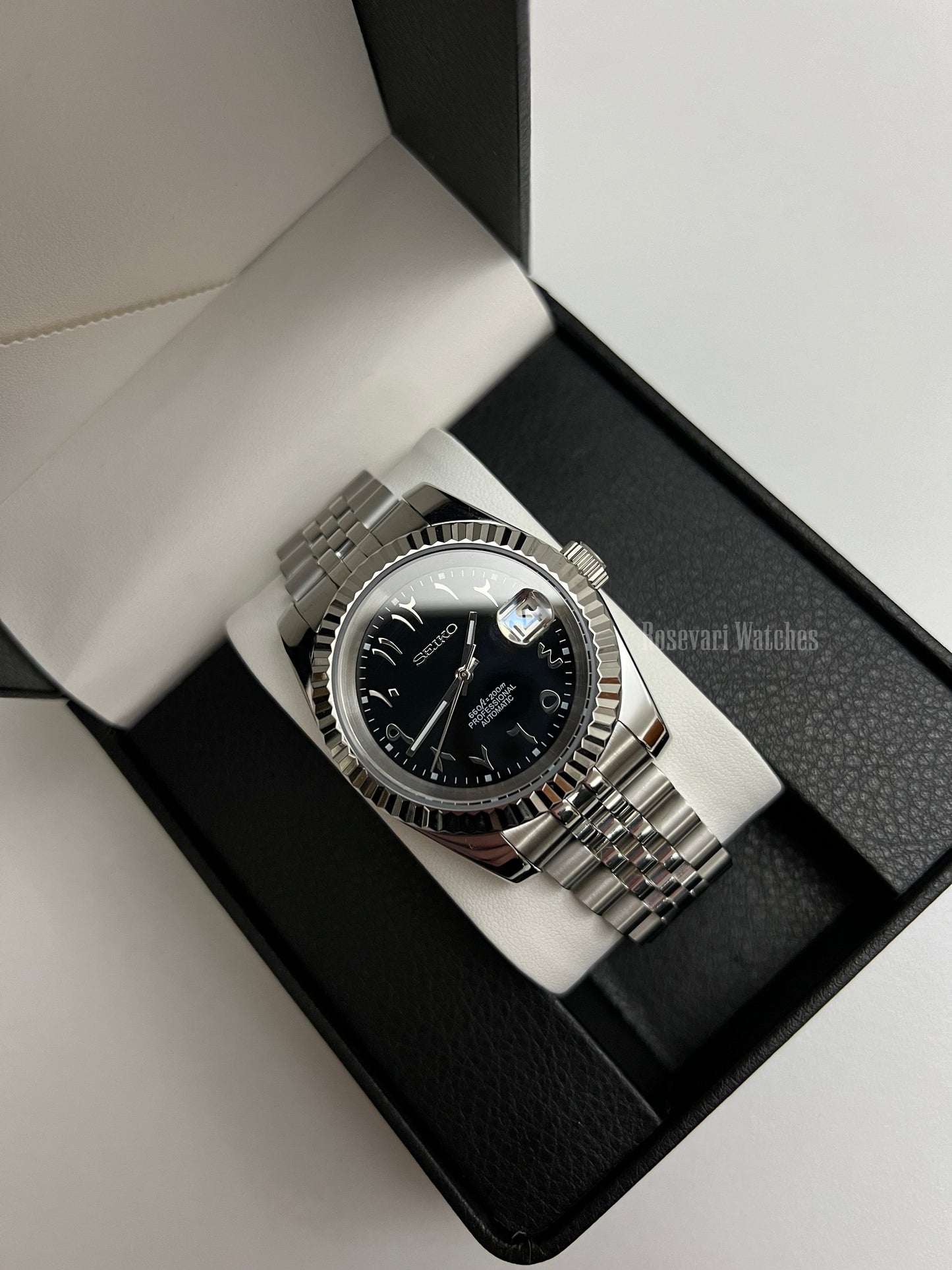 Datejust (Arabic Black) Seiko NH35 automatic mod watch. A black dial watch with a silver fluted bezel and a metal jubilee bracelet inside an open gift box.
