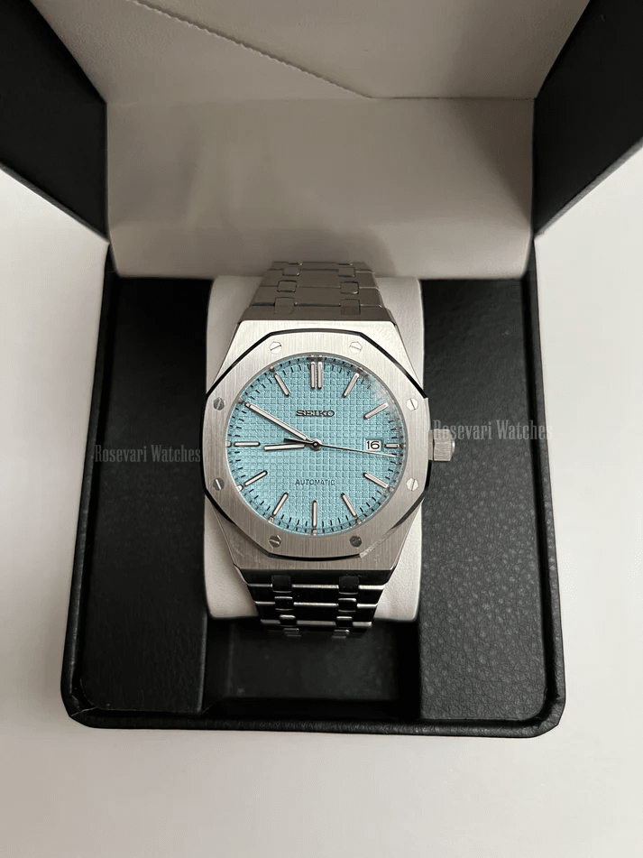 Royal Oak (Light Blue) Seiko NH35 automatic mod watch. A light blue dial watch with a silver bezel and metal bracelet inside a watch box.